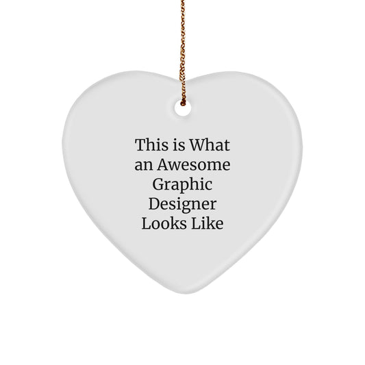 Funny Graphic Designer Gifts from Friends for Christmas - Heart Ornament with 'This Is What An Awesome Graphic Designer Looks Like' Quote - Image 1