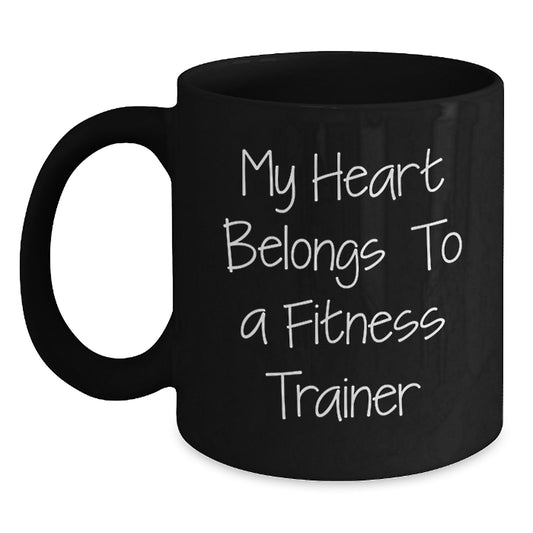 Funny Fitness Trainer Gifts from Friends, My Heart Belongs To A Fitness Trainer Black Coffee Mug for Birthday, Inspirational Quote Black Mug for Men Women - Main