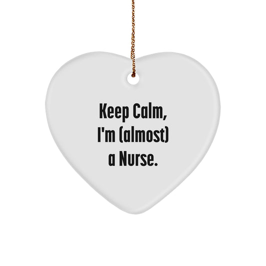 Funny Nurse Gifts for Christmas, Heart Ornament with 'Keep Calm, I'm (almost) A Nurse.' Quote, Gifts from Men to Nurse - Image 1