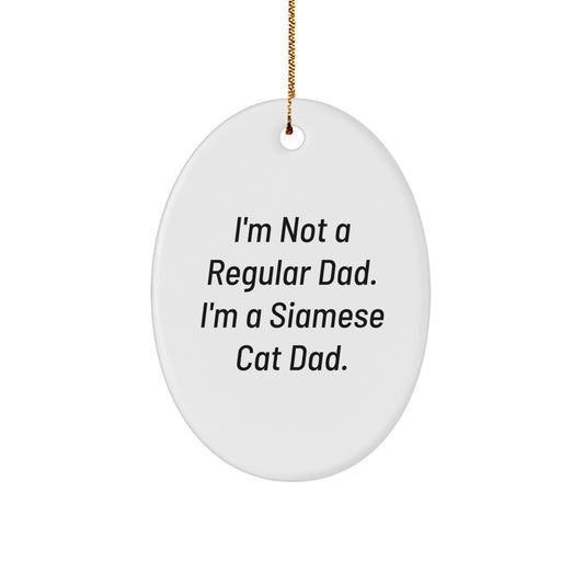 Funny Siamese Cat Dad Gift, Oval Ornament for Men, Women, Friends, or Family, Perfect for Christmas, 'I'm Not A Regular Dad. I'm A Siamese Cat Dad.' - Image 1