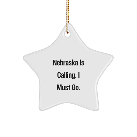 Nebraska Calling, Star Shaped Ornament for Nebraska Gifts, 'Nebraska Is Calling. I Must Go.' Quote, White Color, High-Gloss Finish for Christmas - Image 1