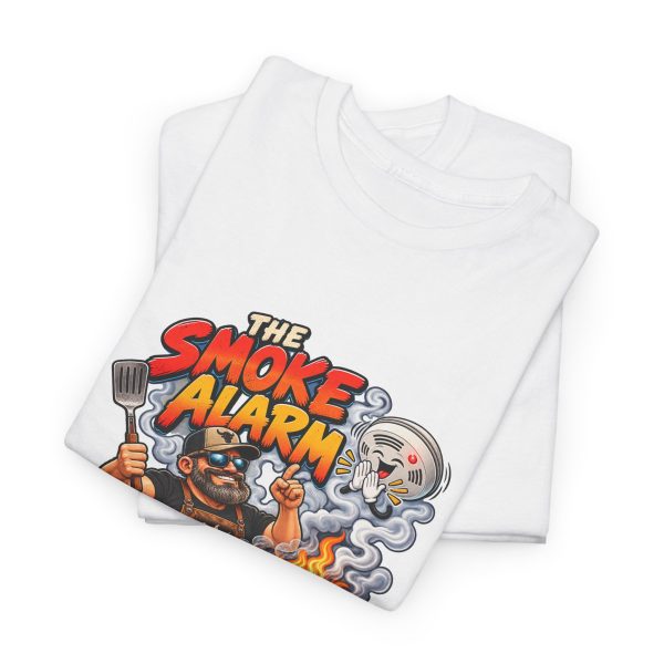 Folded white T-shirt showing "The Smoke Alarm Is Just Applause" BBQ graphic
