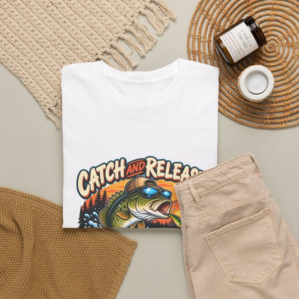 White T-shirt with "Catch and Release My Responsibilities" fishing graphic, lifestyle flat-lay