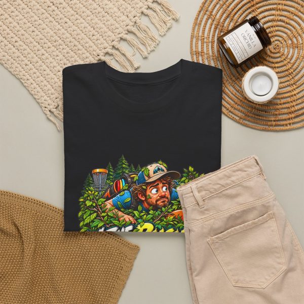 Black T-shirt with "In the Bushes Finding Myself" disc golf graphic, lifestyle flat-lay