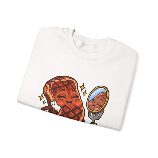 Folded white crewneck sweatshirt showing "Char Marks Are Flavor Freckles" BBQ graphic
