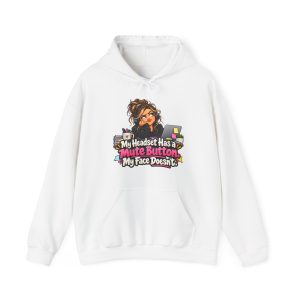 White hoodie printed on the front with a side-eyeing support agent in a black hoodie and headset resting her chin on her hand at a desk with a laptop covered in sticky notes, a mug of pens and a small succulent and the words "My Headset Has a Mute Button. My Face Doesn't."