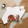 White crewneck sweatshirt with "Char Marks Are Flavor Freckles" BBQ graphic, lifestyle flat-lay