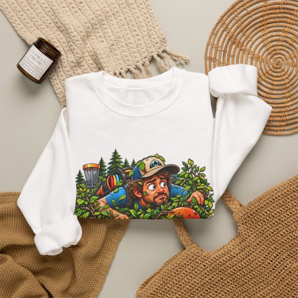 White crewneck sweatshirt with "In the Bushes Finding Myself" disc golf graphic, lifestyle flat-lay