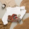 White crewneck sweatshirt with "Christmas Eve. Even The Sleigh Won't Start" mechanic Christmas graphic, lifestyle flat-lay