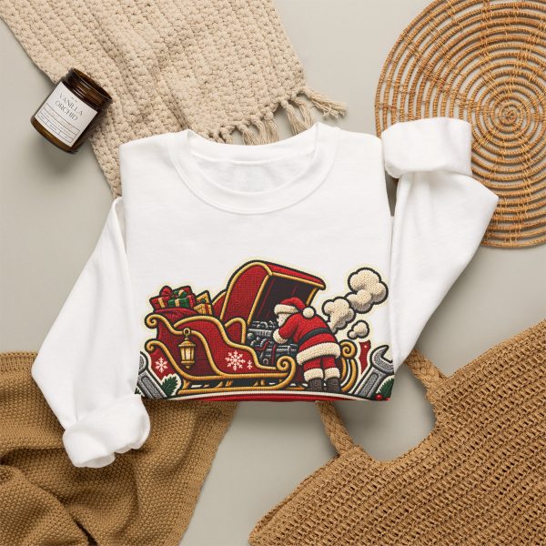 White crewneck sweatshirt with "Christmas Eve. Even The Sleigh Won't Start" mechanic Christmas graphic, lifestyle flat-lay