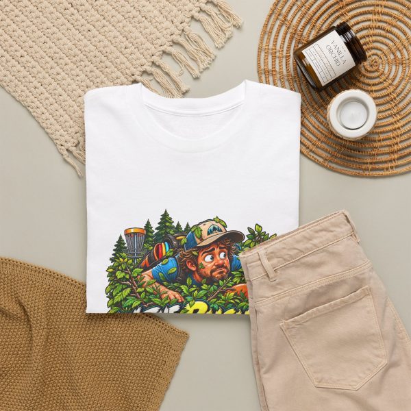 White T-shirt with "In the Bushes Finding Myself" disc golf graphic, lifestyle flat-lay