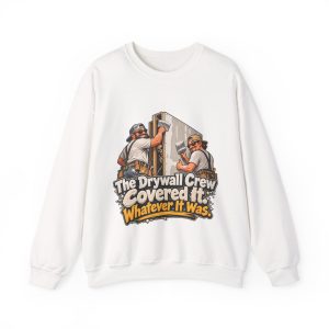 White crewneck sweatshirt printed on the front with two grinning drywallers in sunglasses and suspenders hanging a drywall sheet while a cartoon skeleton peeks out of the open stud bay and the words "The Drywall Crew Covered It. Whatever It Was."