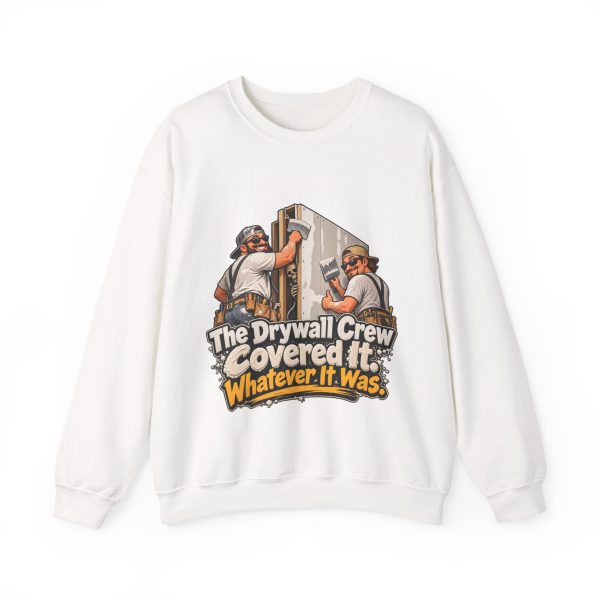 White crewneck sweatshirt printed on the front with two grinning drywallers in sunglasses and suspenders hanging a drywall sheet while a cartoon skeleton peeks out of the open stud bay and the words "The Drywall Crew Covered It. Whatever It Was."