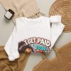 Close-up of the funny deadpan chibi CNA design on the sweatshirt reading "I GET PAID TO BE PEED ON. BARELY."