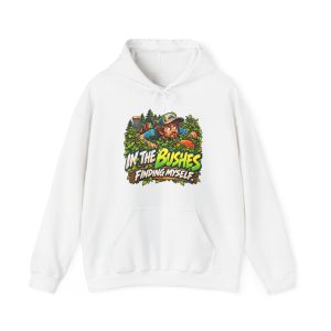 White hoodie printed with "IN THE BUSHES FINDING MYSELF." and a disc golfer in a cap peering out of dense green bushes