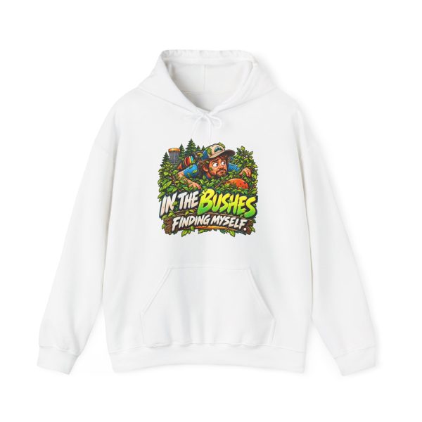 White hoodie printed with "IN THE BUSHES FINDING MYSELF." and a disc golfer in a cap peering out of dense green bushes