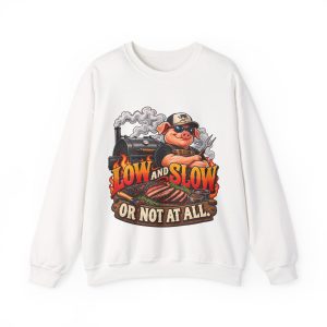 White sweatshirt printed with a cool pig in sunglasses at a smoking offset smoker, with brisket and flame lettering