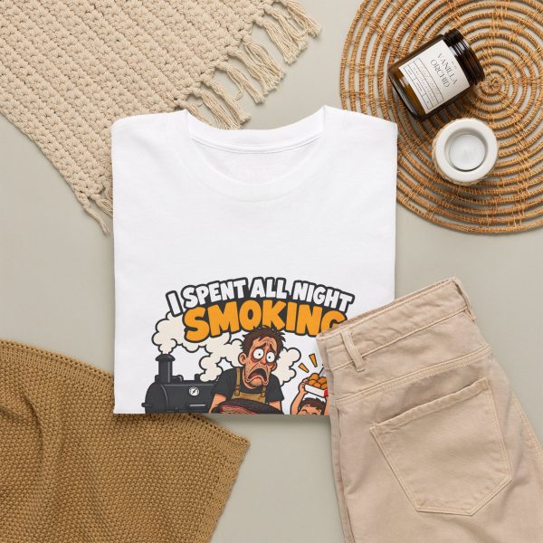 White T-shirt with "I Spent All Night Smoking... The Kids Asked for Nuggets" BBQ dad graphic, lifestyle flat-lay