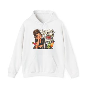 Front of the white unisex hoodie printed with an eye-rolling bartender in a black apron leaning on the bar behind a row of cocktails and a steel shaker and the words “Surprise me” is not a flavor.