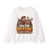 White sweatshirt printed with "DEER SEASON IS MY PERSONALITY NOW." and a grinning hunter