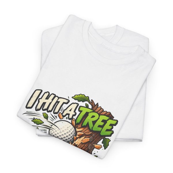 Folded white T-shirt showing "I Hit a Tree and Called It Strategy" golf graphic