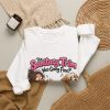 Close-up of the "The Sanitary Trim Was Going Fine. Then He Sat Down." dog groomer design on the sweatshirt