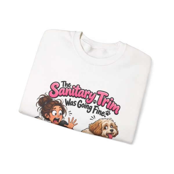 Close-up of the "The Sanitary Trim Was Going Fine. Then He Sat Down." dog groomer design on the sweatshirt