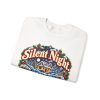 Folded white crewneck sweatshirt showing "Silent Night. Until The Pipes Burst" plumber Christmas graphic