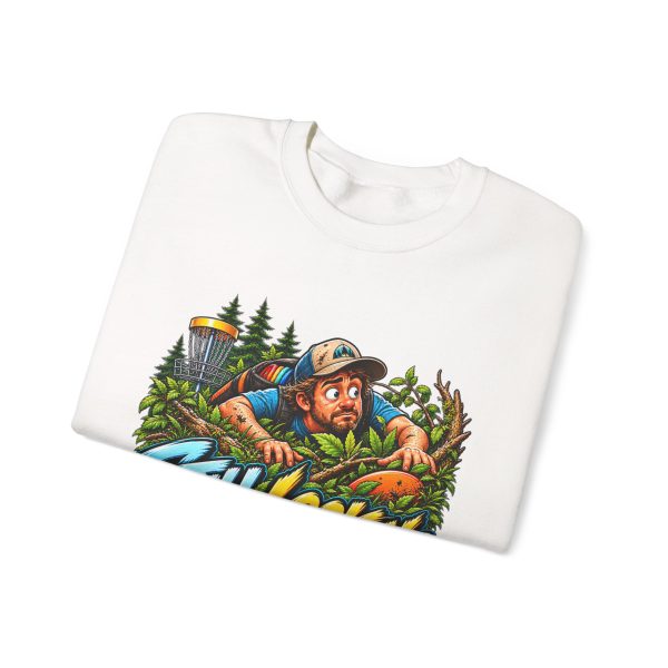 Folded white crewneck sweatshirt showing "Still Looking for My Disc" disc golf graphic