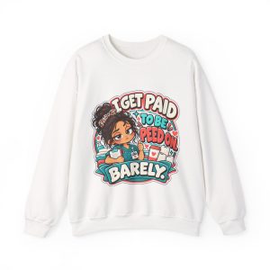 White crewneck sweatshirt printed with "I GET PAID TO BE PEED ON. BARELY." and a tired CNA in teal scrubs giving a thumbs-up