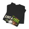 Folded black T-shirt showing "I Hit a Tree and Called It Strategy" golf graphic