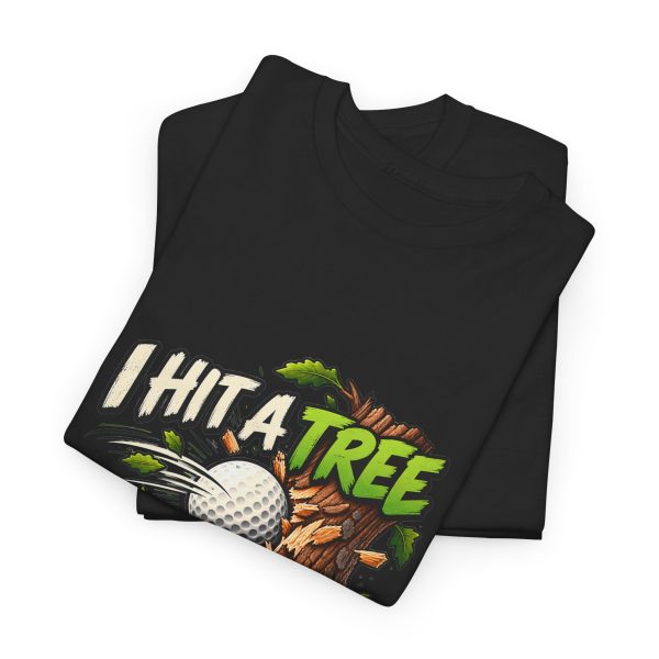 Folded black T-shirt showing "I Hit a Tree and Called It Strategy" golf graphic