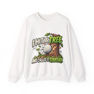 White sweatshirt printed with "I HIT A TREE AND CALLED IT STRATEGY." and a golf ball smashing into a tree trunk