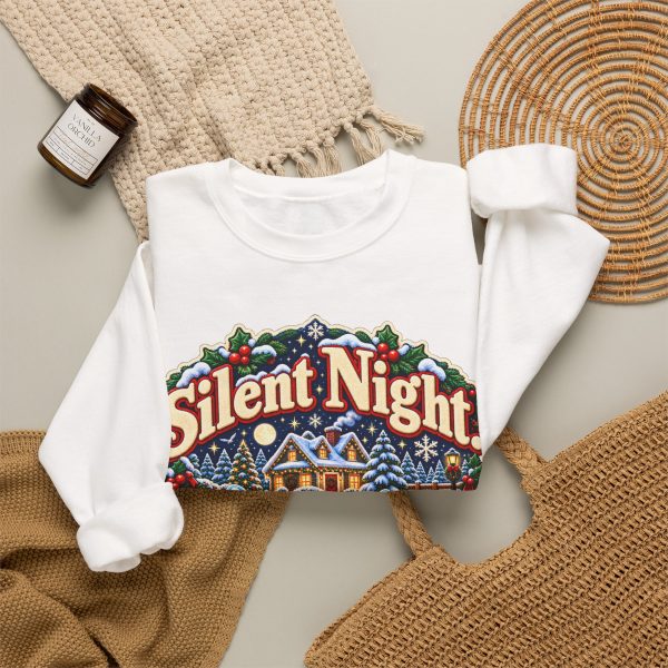 White crewneck sweatshirt with "Silent Night. Until The Pipes Burst" plumber Christmas graphic, lifestyle flat-lay