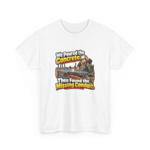 White t-shirt printed on the front with a horrified construction worker in a hard hat and hi-vis vest kneeling on a fresh concrete slab, with orange conduit visible buried in the gravel below and the words "We Poured the Concrete. Then Found the Missing Conduit."