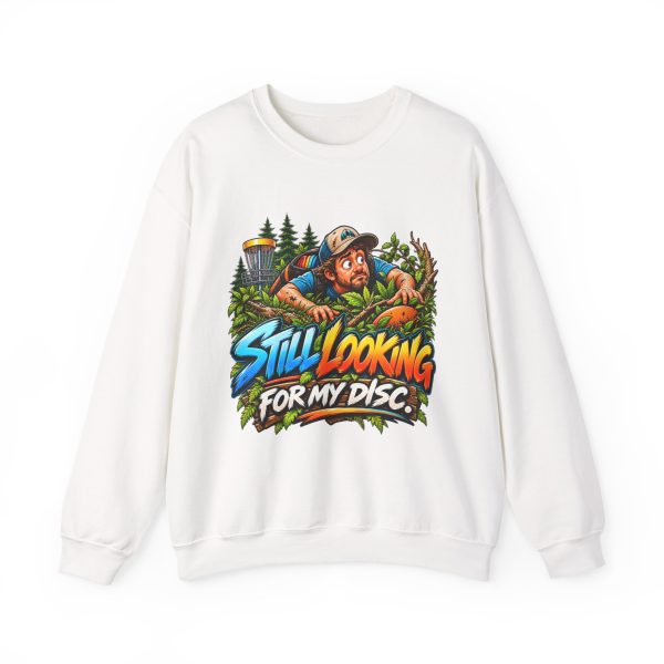 White disc golf crewneck sweatshirt printed with STILL LOOKING FOR MY DISC and a wide-eyed disc golfer crawling through thick brush and branches