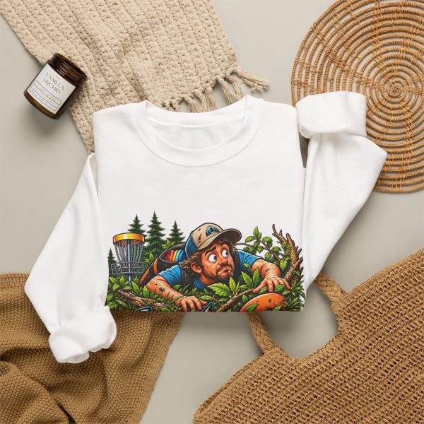 White crewneck sweatshirt with "Still Looking for My Disc" disc golf graphic, lifestyle flat-lay