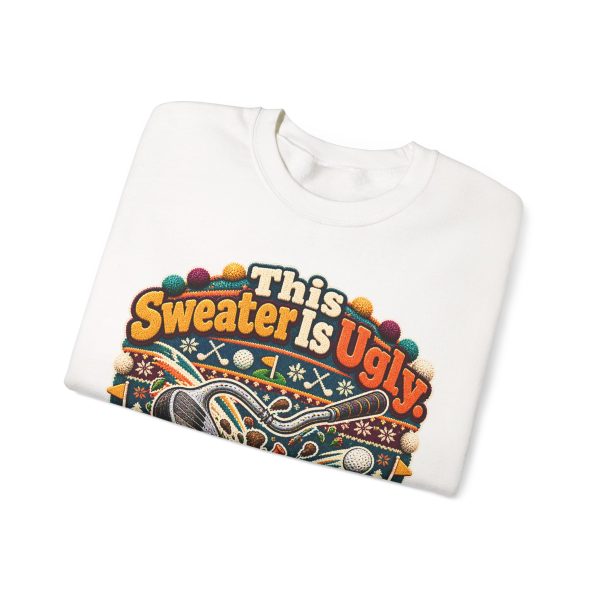 Folded white crewneck sweatshirt showing "This Sweater Is Ugly. You Should See My Golf Swing." golf Christmas graphic