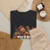 Black T-shirt with "Deer Season Is My Personality Now" hunting graphic, lifestyle flat-lay