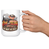 15oz white BBQ mug with a cool pig in sunglasses at a smoking offset smoker, with flame lettering, held up by the handle