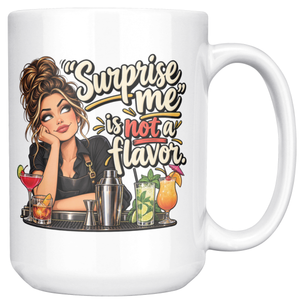 White 15oz ceramic mug with the handle on the right, showing an eye-rolling bartender in a black apron leaning on the bar behind a row of cocktails and a steel shaker and the words “Surprise me” is not a flavor.