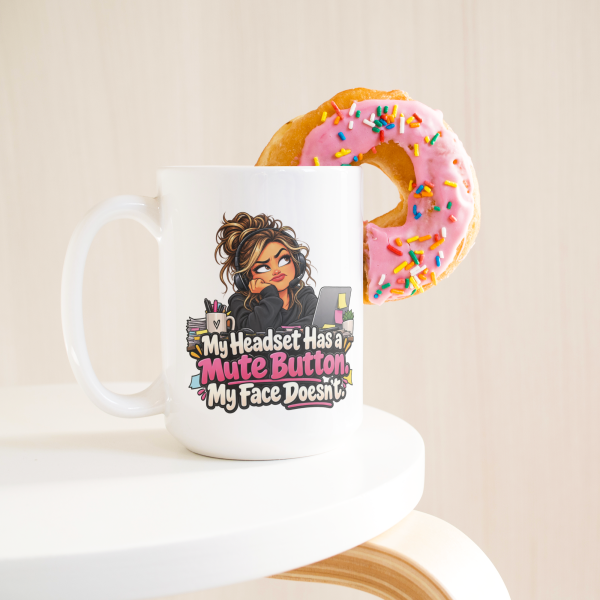 My Headset Has a Mute Button. My Face Doesn't. funny 15oz white coffee mug, on a table with a donut