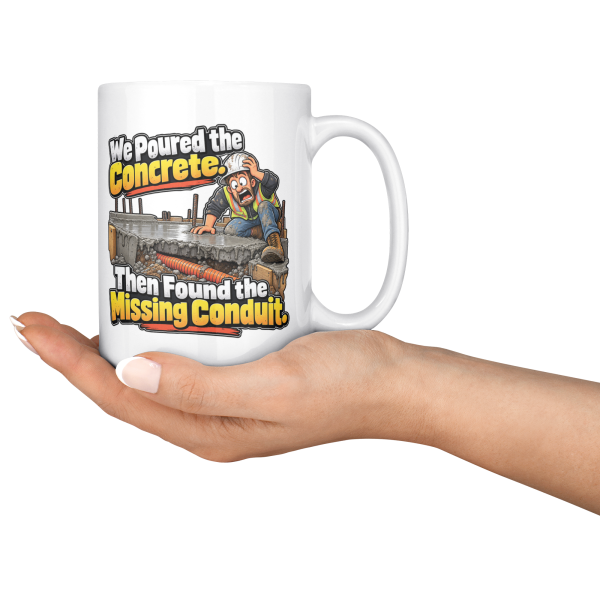 We Poured the Concrete. Then Found the Missing Conduit. funny 15oz white coffee mug, held out in one hand
