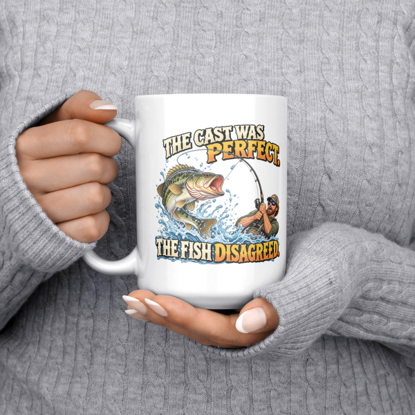 The Cast Was Perfect. The Fish Disagreed. funny 15oz white mug, held at chest