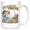 15oz white ceramic fishing mug printed with THE CAST WAS PERFECT. THE FISH DISAGREED and a fisherman in a cap and sunglasses hauling on a bent rod
