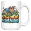 15oz white ceramic golf mug printed with STILL LOOKING FOR THAT FAIRWAY. and a squinting golfer crawling through the rough