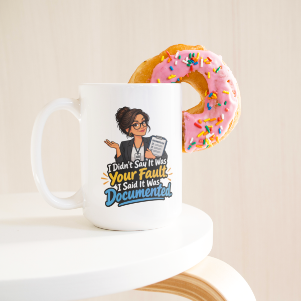 I Didn't Say It Was Your Fault. I Said It Was Documented. 15oz mug - with a donut I Didn't Say It Was Your Fault. I Said It Was Documented. funny 15oz white coffee mug, on a table with a donut