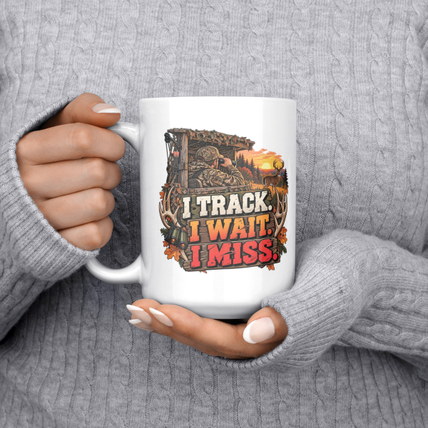 I Track. I Wait. I Miss. funny 15oz white mug, held at chest