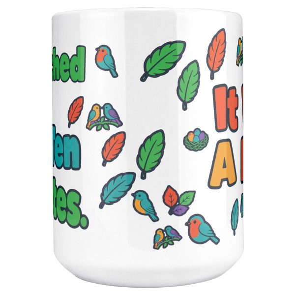 "I watched it for ten minutes. It was a leaf." Birding 15oz mug, front view of the wrap 15 oz white ceramic birding mug, "I watched it for ten minutes" on one side and "It was a leaf" on the other, with birds, binoculars and leaves, front view of the wrap