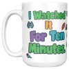 "I watched it for ten minutes. It was a leaf." Birding 15oz mug, handle on the left, first side 15 oz white ceramic birding mug, "I watched it for ten minutes" on one side and "It was a leaf" on the other, with birds, binoculars and leaves, handle on the left, first side